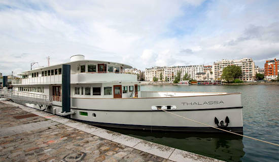 Lunch or dinner on the Seine aboard the legendary Thalassa boat
